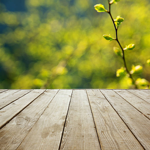 istock Wooden perspective floor with planks on blurred background 475430346