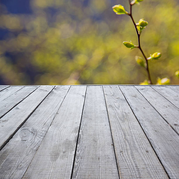 istock Wooden perspective floor with planks on blurred background 475430350