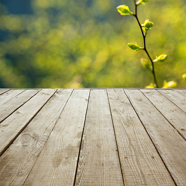 istock Wooden perspective floor with planks on blurred background 475430356