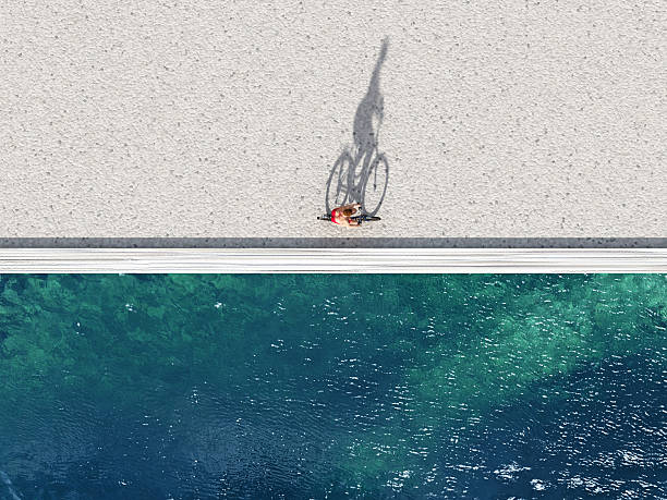여자 자전거를 타고 여름 해변 - embankment 뉴스 사진 이미지
