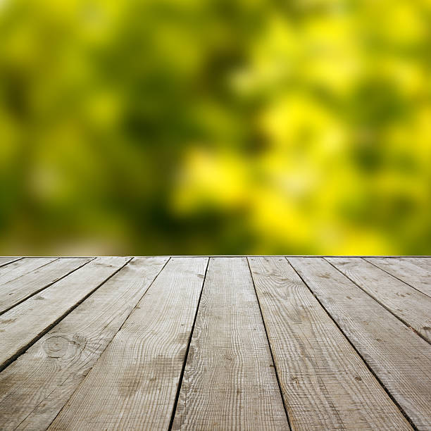 istock Wooden perspective floor with planks on blurred background 475431440