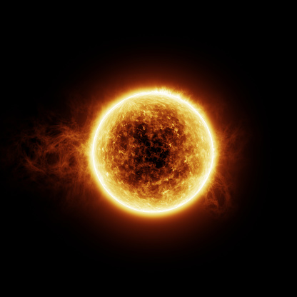 Burning sun with flares on a black background with room for text or copy space