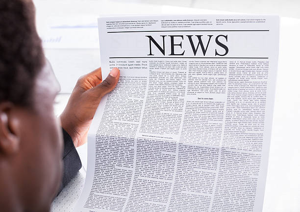 istock Happy Businessman Reading Newspaper 475434292