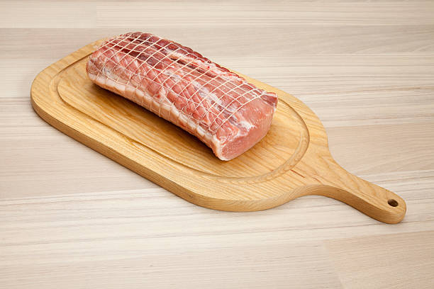 istock Raw rolled pork roast on chopping board 475435296