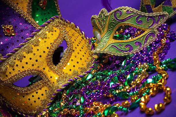 istock Assorted Mardi Gras or Carnivale masks on a purple background 475435309
