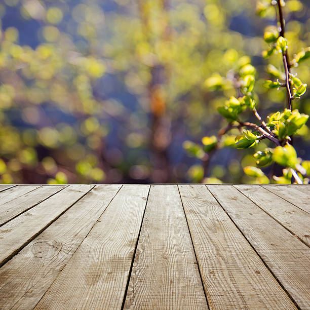 istock Wooden perspective floor with planks on blurred background 475435360