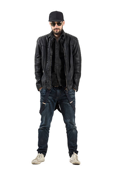 istock Bearded man in black leather jacket with cap and sunglasses 475435870