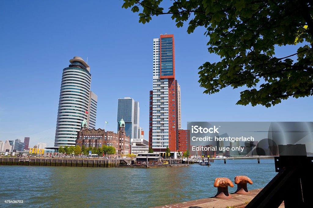 Rotterdam, Netherlands Rotterdam, Netherlands - May 24, 2015: The Hotel New York (old building in the centre of the photo) is situated in the former head office of the Holland America Line - at the end of the Wilhelminapier on the city peninsula between Rijnhaven and Nieuwe Maas. A redeveloped former industrial area with new high-rise residential buildings. 2015 Stock Photo