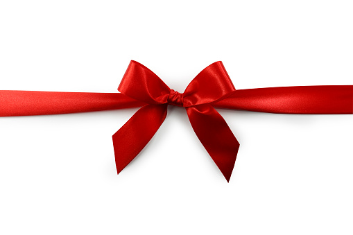 A red satin ribbon tied in a bow over a pure white background. Clipping Path Included.