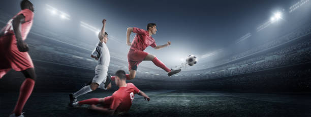 istock Soccer player kicking ball in stadium 475437570