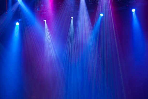 concert lighting Blue and purple concert stage lights. stage light stock pictures, royalty-free photos & images