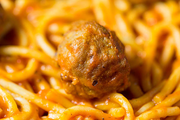 Close view of spaghetti and a meatball