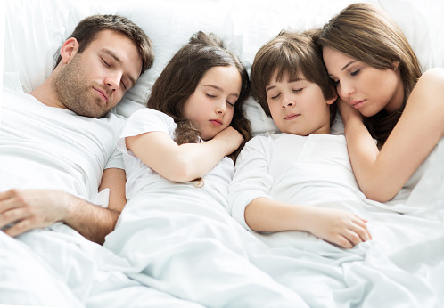Family of four sleeping