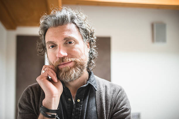 istock pensive mature man with long beard 475439580