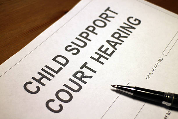istock Child Support Court Hearing Document on a desk 475439798