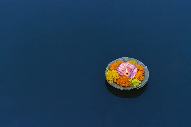 Puja In Varanasi, India Candle Floating in the Ganges at Varanasi, India varanasi stock pictures, royalty-free photos & images