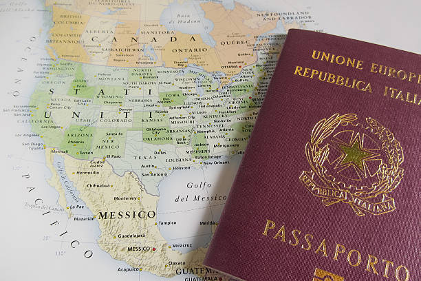 istock Italian passport over USA map 475439908