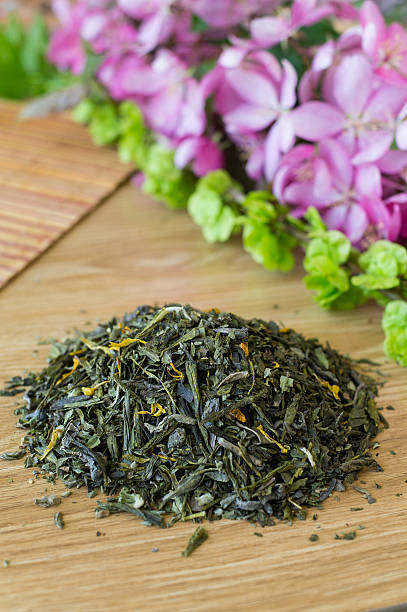 istock Blend of green tea on a table with colours. 475441238