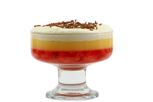 Strawberry trifle in sundae glass isolated on white Strawberry trifle in sundae glass isolated on white trifle stock pictures, royalty-free photos & images