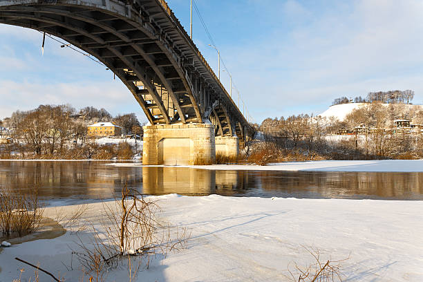 istock bridge over the river in winter 475443497