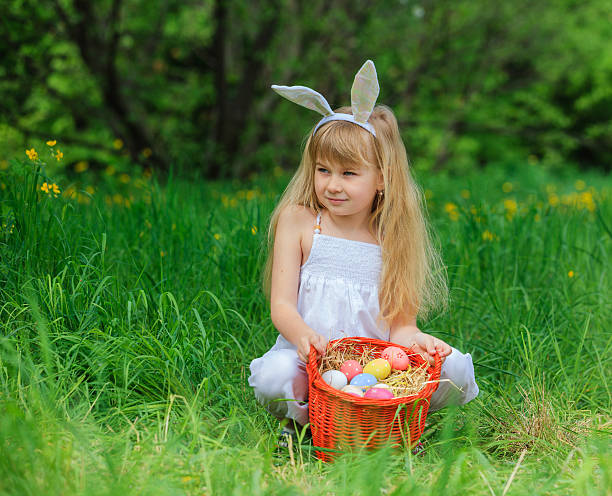 istock Little girl wearing bunny ears 475444720