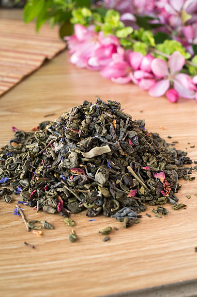 istock Blend of green tea on a table with colours. 475444910