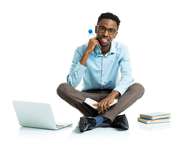 istock Happy african american college student sitting with laptop 475446464