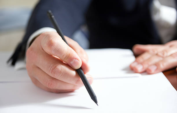 istock Business man's hands signing business documents. Signing papers. 475447362