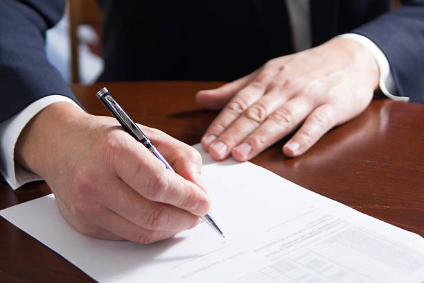 istock Business man's hands signing business documents. Signing papers. 475447486
