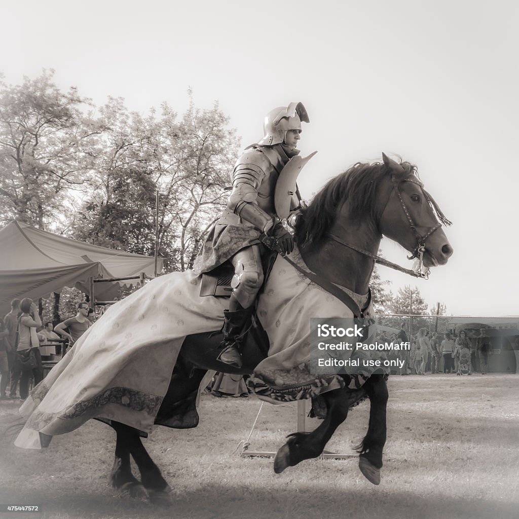 Rievocandum2015 Knights Quattro Castella, Italy - May 17, 2015: warriors in medieval staged battle at festival "RIEVOCANDUM1111" A.D. 1557 devoted to the life in middle ages, on May 17, 2015 in Quattro Castella, Italy Jousting Stock Photo