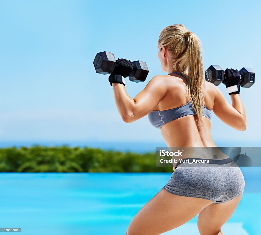 Work them glutes! Shot of a beautiful young woman exercising outsidehttp://195.154.178.81/DATA/i_collage/pi/shoots/804721.jpg Exercising Stock Photo