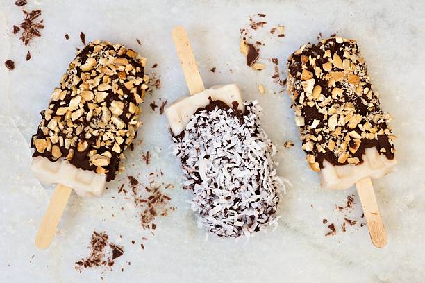 istock Homemade chocolate dipped popsicles with coconut and nuts 475448372