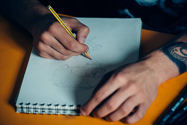 istock Tattoo Artist Drawing 475448576