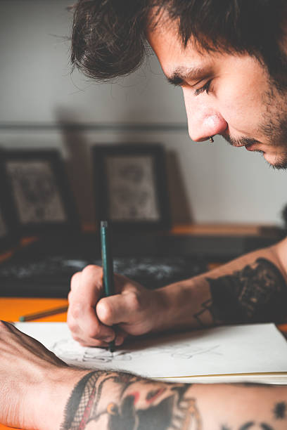 istock Tattoo Artist Drawing 475448618