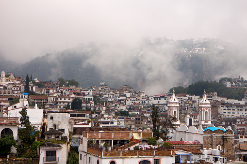 Hazy view of beautiful historic town of Taxco de Alarcon, Guerrero, Mexico.