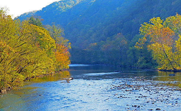 istock Fall colors and blue waters along the Pigeon River. 475449726