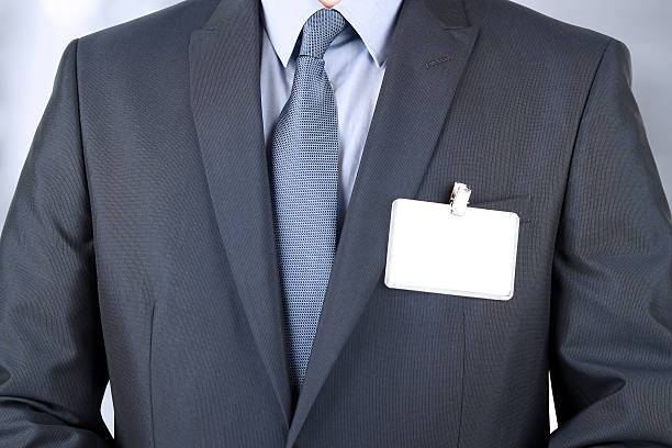 istock The business man showing a  Blank Badge 475449730