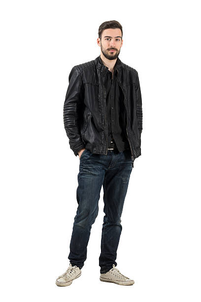 istock Young bearded fashion model looking at camera in leather jacket 475451794