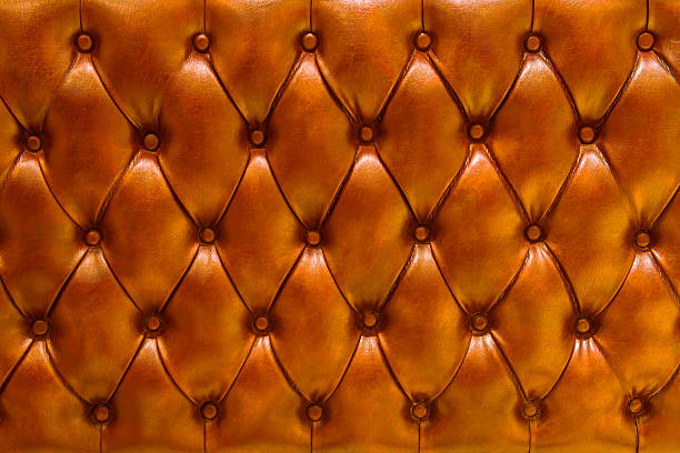 istock Leather upholstery background in orange 475453753