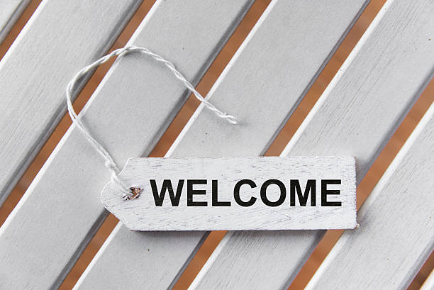istock White wooden label with welcome sign 475453946