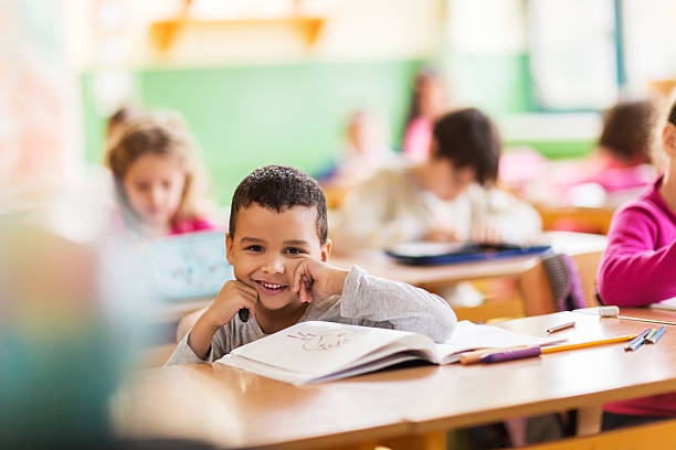 istock Happy African American schoolboy during a class in the classroom. 475455108