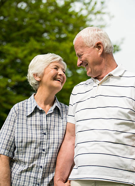 istock Senior couple walking together 475456444
