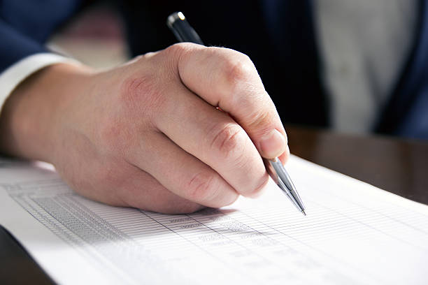 istock Business man's hands signing business documents. Signing papers. 475457696
