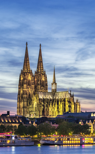 Evening. Cologne Cathedral is a Roman Catholic cathedral in Cologne, Germany.  It is a renowned monument of German Catholicism and Gothic architecture and is a World Heritage Site