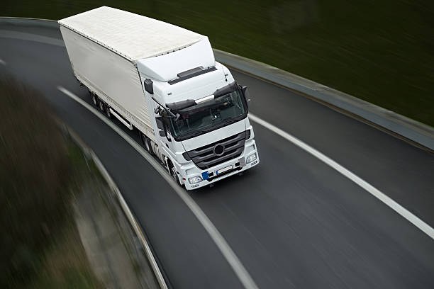 istock white semi truck on highway 475466436