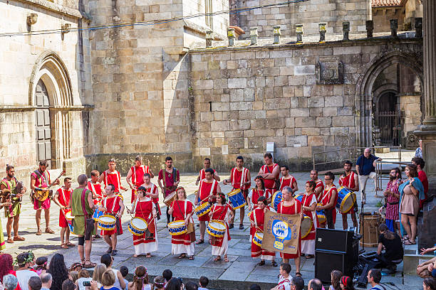 Home of the disabled playing the drums at Roman festival Braga, Portugal - May, 23rd 2015: Roman folklore band and from the home of the disabled playing the drums. This roman festival depicting the period where romans named the city of Braga, Bracara Augusta its original roman name by César Augusto. ancient rome stock pictures, royalty-free photos & images