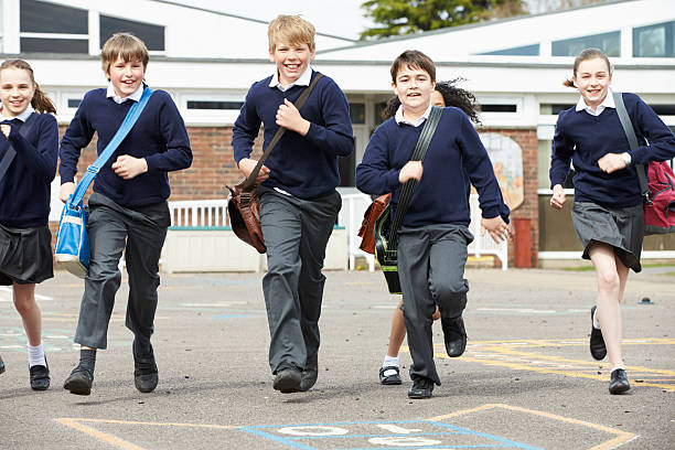 istock Group Of Elementary School Pupils Running In Playground 475468721