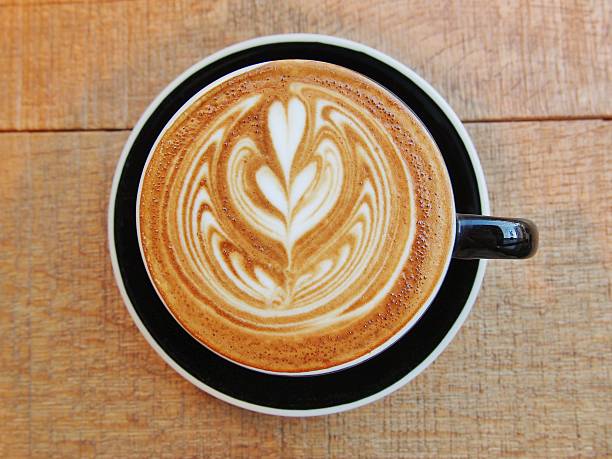 istock Latte Coffee art on the wooden desk. 475472748