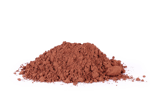 Heap of fresh cacao powder isolated on white ckground