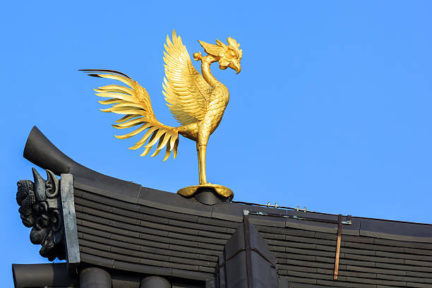 Phoenix Ornamaent on the Roof of Byodo-in Temple in Kyoto Kyoto, Japan - October 21 2014: Byodoin temple built in 998 AD during the Heian period, originally a private residence and converted into a temple by a member of the Fujiwara clan in 1052 heian period stock pictures, royalty-free photos & images